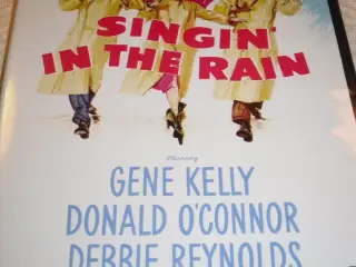 Singing IN THE RAIN.
