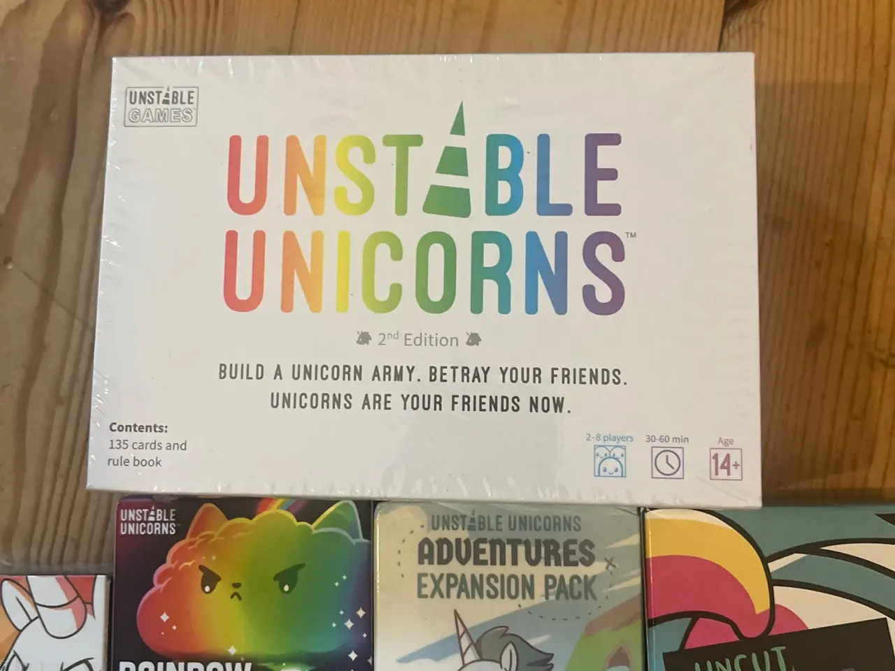 Billede 2 - Unstable Unicorns brætspil med 7 expansion packs