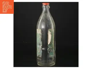 Gammel flaske med etiket (str. 22x6 cm)