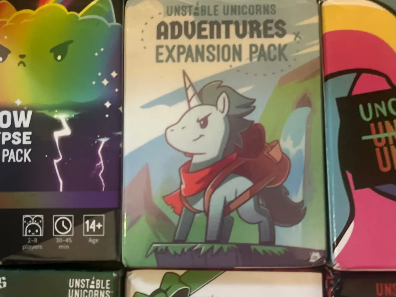 Billede 5 - Unstable Unicorns brætspil med 7 expansion packs