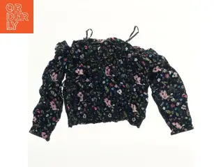 Bluse med blomsterprint fra H&M (str. 152)