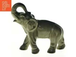 Elefant med løftet snabel i porcelæn (str. 17 x 15 cm)
