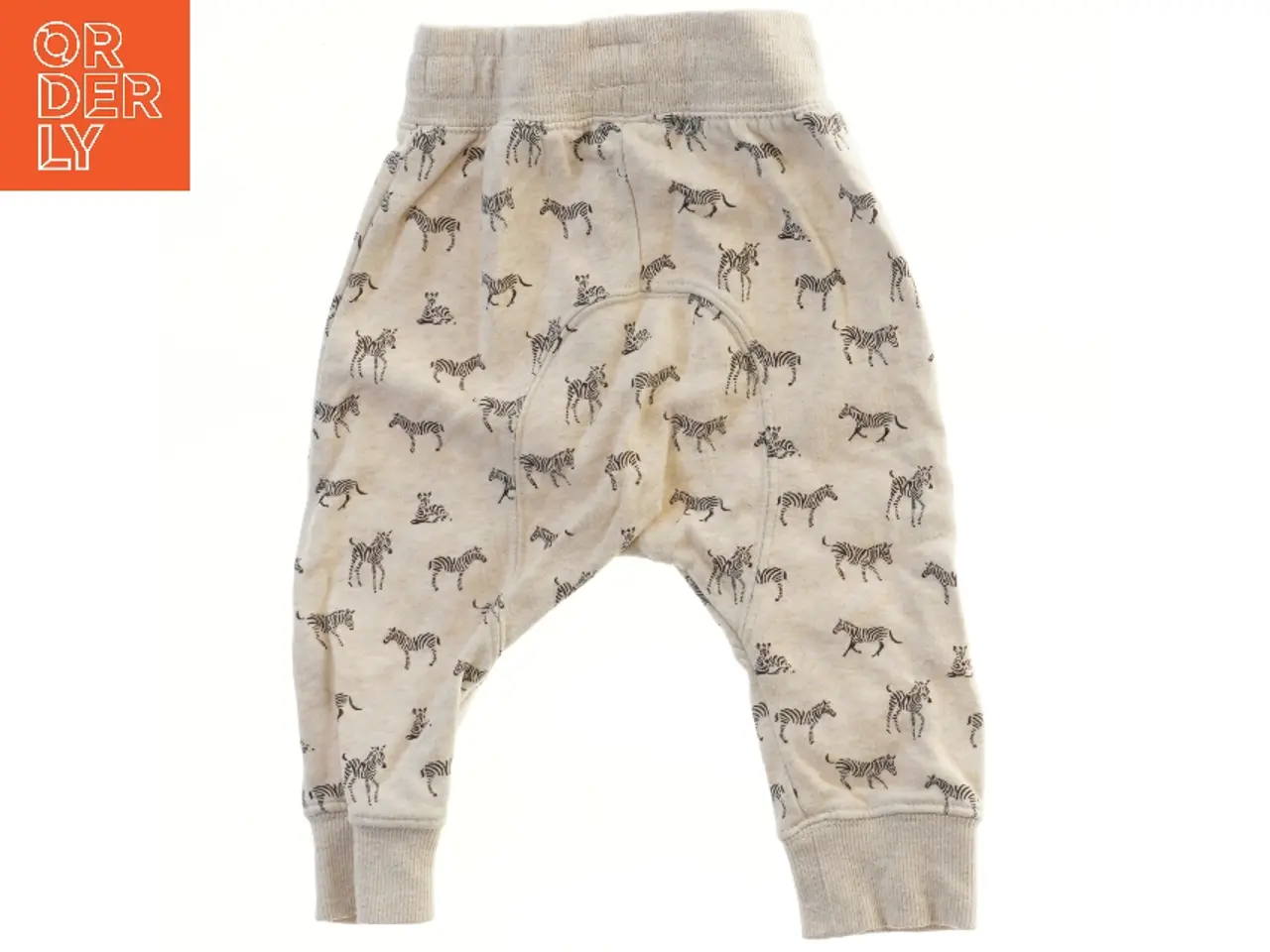 Billede 2 - Børnebukser med zebra print fra H&M (str. 74)