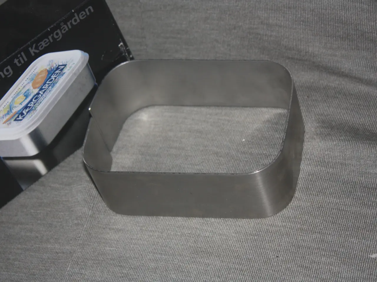 Billede 1 - Stålholder / Cover ring til en pakke Kærgården