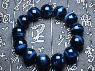Tiger Eye armbånd m.16 mm perler i mellem blå