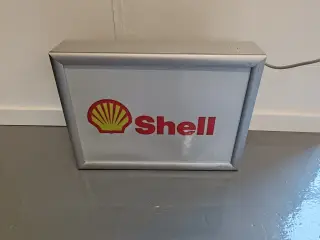 Shell lysskilt