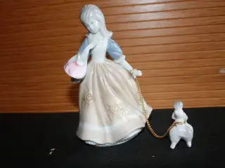 Figur af ung pige med hund