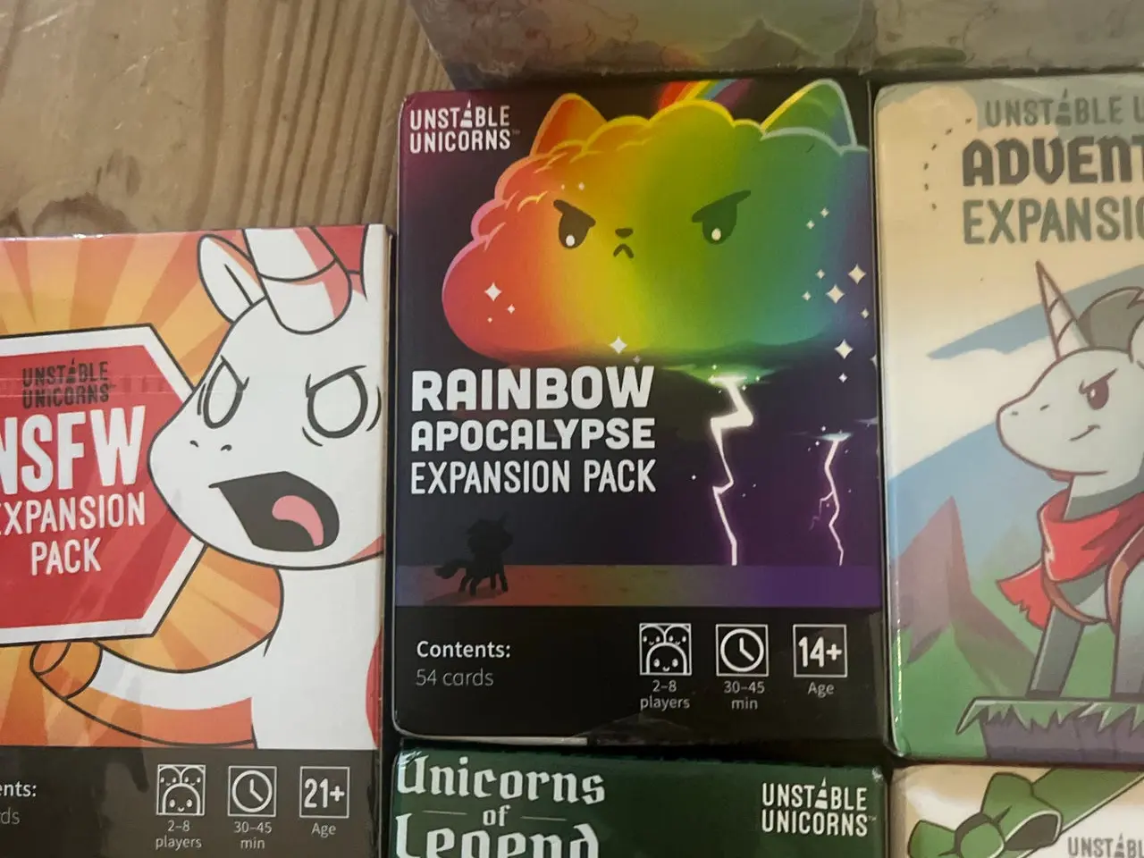 Billede 4 - Unstable Unicorns brætspil med 7 expansion packs