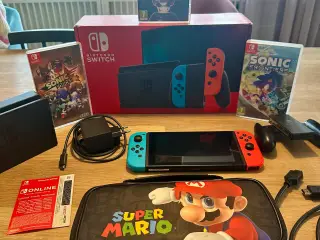 Nintendo switch med 3 spil, Mario cover og abo.