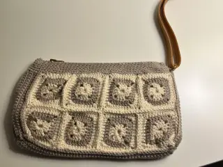 Clutch med for og håndledsrem
