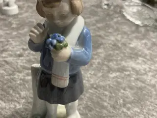 Pige med forårsblomster