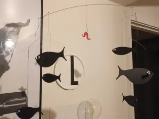 Flensted fiske uro med orm på krog