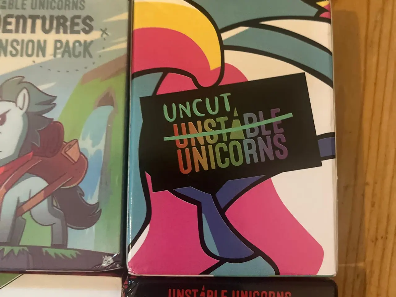 Billede 6 - Unstable Unicorns brætspil med 7 expansion packs