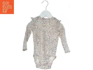 Blomstret bodystocking med lange ærmer fra H&M (str. 74)