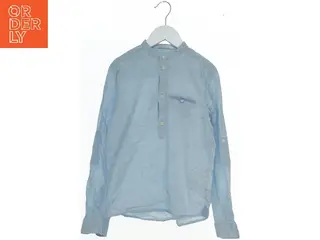 Lyseblå skjorte til børn fra H&M (str. 146)