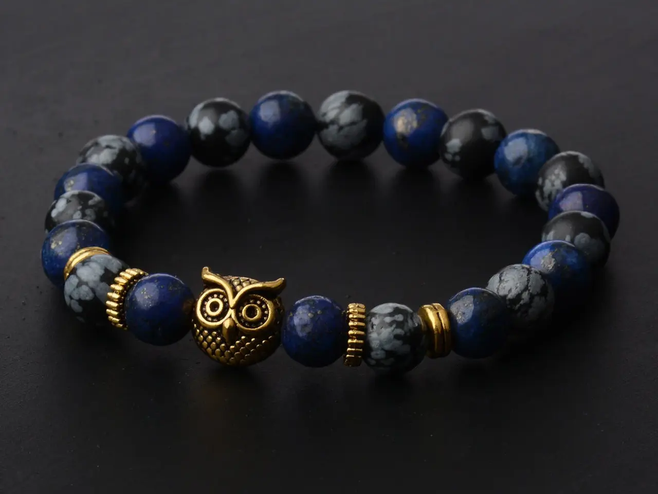 Billede 1 - Armbånd i blå lavasten-Charm:UGLE