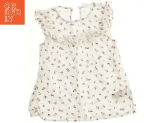 Blomstret bluse med flæser fra H&M (str. 92)