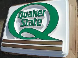 Stor flot Quaker State skilt.