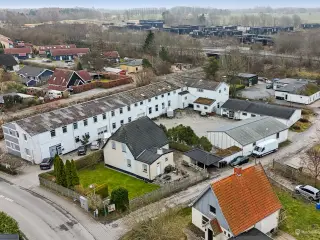 Projekt - udviklingsejendom til opførelse af 15 boligenheder og 1 erhvervsenhed