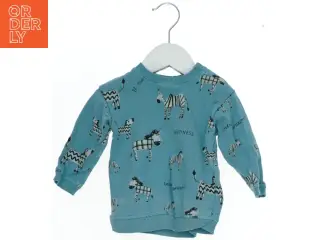 Langærmet bluse med zebra design fra H&M (str. 74)